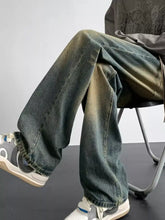 Men’s full size vintage wash loose fit wide-leg denim jeans with faded gradient wash from dark indigo to beige