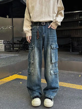 Men’s blue denim vintage wash wide-leg cargo jeans featuring multiple large pockets and a relaxed fit