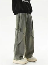 Men’s full size vintage wash wide leg cargo jeans in gray green with loose fit, multiple pockets, and angled seams
