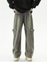 Men’s full size vintage wash wide leg cargo jeans in faded olive-green denim with multiple pockets and buttoned flaps