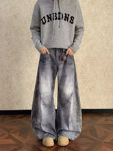 Men’s gray faded denim wide-leg jeans with distressed vintage wash and visible stitching details plus size vintage wash wide