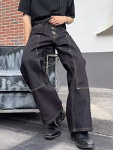 Men’s full size vintage wash wide leg jeans in dark-wash denim with contrasting white stitching and relaxed wide leg cut