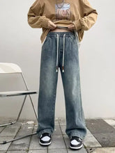 Men’s full size vintage wash wide leg jeans in faded blue denim with white drawstrings for plus size fit
