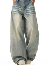 Men’s full size vintage wash wide leg jeans in faded light blue denim with subtle distressing and cargo-style pockets