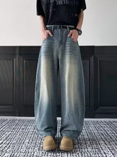 Men’s full size vintage wash wide leg jeans in faded gradient denim from dark blue to light beige at the ankles