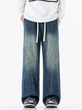 Men’s full size vintage wash wide leg denim jeans in faded blue with white drawstrings for plus size comfort