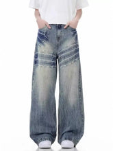 Men’s full size vintage wash wide leg jeans in faded denim with distressed details and subtle horizontal stitching