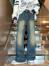 Men’s full size vintage wash dark-wash wide leg jeans with faded distressed look and subtle yellowish stains on thighs
