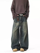 Men’s full size vintage wash wide leg jeans in dark blue denim with a faded distressed look and plus size design