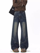 Men’s dark-wash denim jeans with vintage wash wide leg and visible stitching in full size vintage wash style