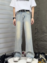 Men’s full size vintage wash light-wash denim wide leg jeans with straight cut and faded distressing on thighs