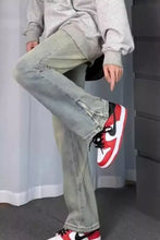Men’s full size vintage wash wide-leg jeans in light-wash denim with relaxed fit and subtle distressing details