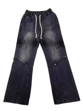 Men’s black denim vintage wash wide-leg jeans with white drawstring waistband and silver rivet details, relaxed fit