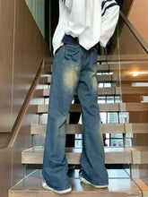 Men’s full size blue denim wide leg jeans with vintage wash and classic back pockets shown from the back side