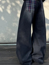 Men’s vintage wash wide-leg jeans in dark wash denim with plaid patch pockets and a relaxed silhouette