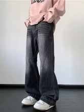 Men’s full size vintage wash wide leg jeans in dark gray denim with faded wash and visible stitching details