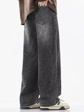 Men’s full size vintage wash wide leg jeans in dark gray denim with faded distressed finish and classic stitching