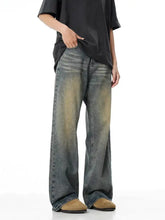Men’s full size vintage wash wide leg jeans in dark blue and yellowish-brown denim with a faded distressed finish