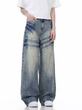 Men’s full size vintage wash wide leg jeans in denim with faded bleach streaks and frayed edges for a distressed look