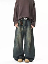 Men’s full size vintage wash wide leg jeans in dark blue denim with a faded distressed look and plus size fit