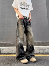 Men’s full size vintage wash wide leg jeans in faded black and gray denim with distressed texture and five-pocket design