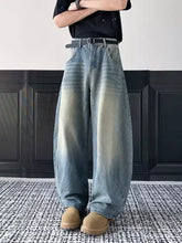 Men’s full size vintage wash wide-leg denim jeans in faded blue with subtle distressing details