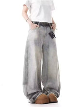 Men’s full size vintage wash wide leg jeans in faded gray denim with subtle distressing and a black belt