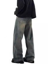 Men’s full size vintage wash wide-leg jeans in faded gray denim with subtle distressing and frayed hems