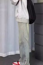 Men’s full size vintage wash wide leg jeans in light-wash denim with a relaxed fit and subtle fading