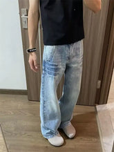 Men’s full size vintage wash wide leg jeans in light-wash denim with relaxed fit and subtle fading details