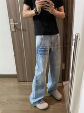 Men’s light-wash denim full size vintage wash wide leg jeans with a relaxed straight-leg cut and subtle fading details