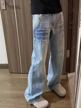 Men’s full size vintage wash wide leg jeans in light wash denim with a slightly faded wide leg design