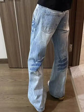 Men’s light-wash denim wide leg jeans with vintage wash and distressed knees in full size plus size fit