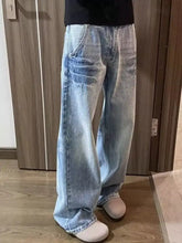 Men’s full size vintage wash wide leg jeans in light-wash denim with a relaxed fit and subtle distressing details
