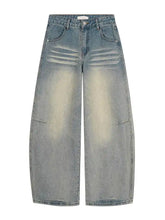 Men’s full size vintage wash wide leg jeans in light-wash denim with subtle fading and wide-leg cut