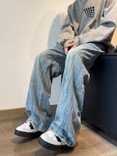 Men’s full size vintage wash wide-leg jeans in faded blue and gray striped denim with a vintage wash wide finish