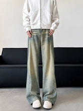 Men’s full size vintage wash wide leg jeans in faded distressed denim with subtle color gradients plus size fit