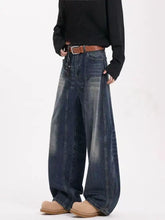 Men’s dark-wash denim vintage wide leg jeans with faded distressed look and visible stitching details in full size plus size
