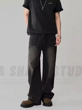 Men’s black wide-leg denim loose fit jeans with faded distressed look and subtle thigh fading plus size fit jeans