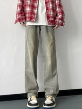Men’s full size wash loose fit jeans in light-wash denim with a relaxed straight-leg cut and visible side pockets