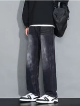Men’s plus size loose fit dark-wash denim jeans with faded gradient effect to lighter gray at the thighs