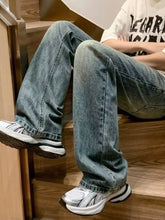 Men’s full size wash light-wash denim loose fit jeans with relaxed straight-leg cut and classic stitching details