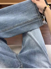 Men’s light-wash denim full size wash relaxed fit jeans with straight-leg cut and visible stitching details