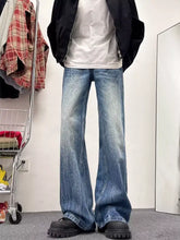 Men’s full size wash wide leg jeans in blue denim with faded wash and subtle whiskering details slightly stretchy care instructions