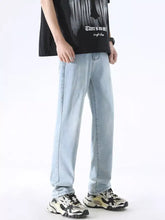 Men’s full size wash wide leg jeans in light-wash premium cotton with relaxed fit and classic stitching details for perfect fit