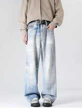 Men’s plus size wide-leg denim jeans with faded cloud-like wash and subtle distressing full size wash design