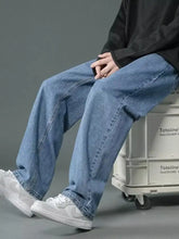 Men’s full size wash wide leg jeans in light-wash blue denim with a relaxed straight-leg cut