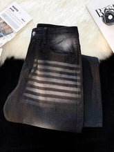 Men’s black denim shorts with a faded distressed look and gray stripes in size wash wide leg plus size jeans style