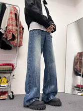 Men’s full size wash wide-leg jeans in blue denim with a faded wash and slightly stretchy fabric including care instructions