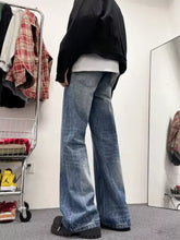 Men’s full size wash wide-leg jeans in blue denim with a relaxed fit and slightly stretchy fabric care instructions included